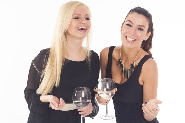 Two beautiful elegant party girls on white isolated background - Foto, afbeelding