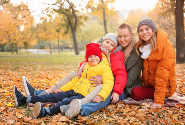 Happy family in autumn park - Foto, imagen