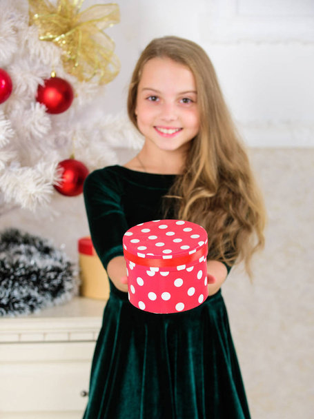 Time to open christmas gifts. Merry christmas concept. Dreams come true. Best for our kids. Kid girl near christmas tree hold gift box. Child celebrate christmas at home. Favorite day of the year - Foto, immagini