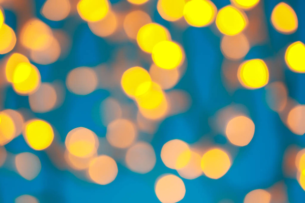 Λαμπερό φώτα των Χριστουγέννων για το χρώμα φόντου, θολή προβολή - Φωτογραφία, εικόνα