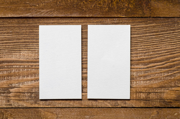 white blank business card on a wooden background - Φωτογραφία, εικόνα