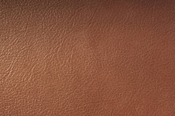 Detailní záběr na pozadí z hnědé kůže nebo textury. - Fotografie, Obrázek