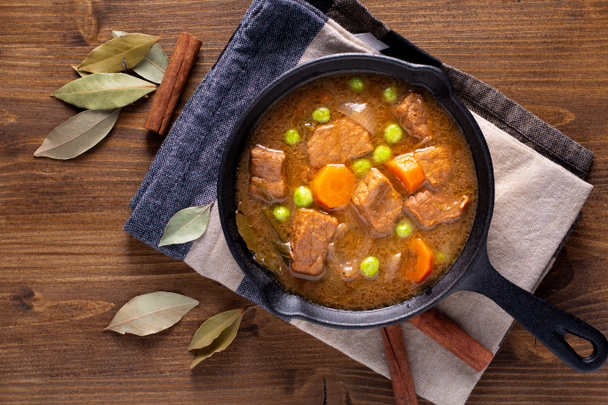 Winter Food concept homemade organic stew beef or bourguignon in Cast-Iron Skillet pan with copy space - Photo, Image