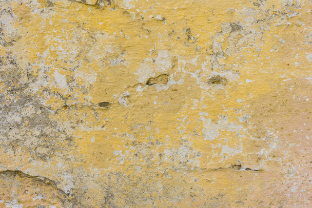 Wall fragment with scratches and cracks. It can be used as a background - Фото, зображення