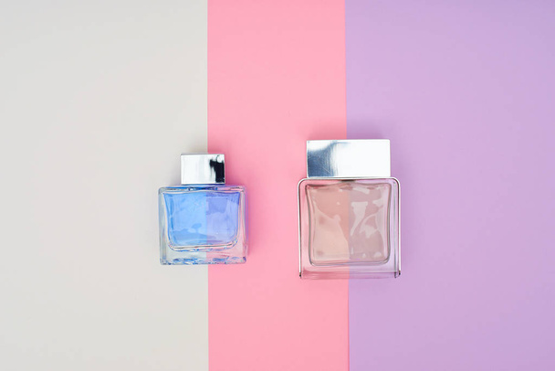 Perfume bottles on pastel background. Minimal style. - Photo, Image