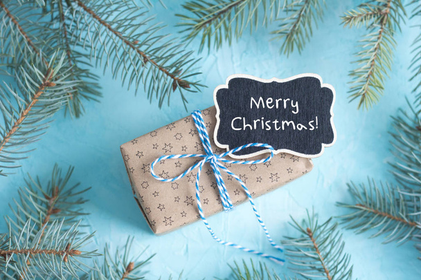 Christmas gift box on the blue background - Fotó, kép
