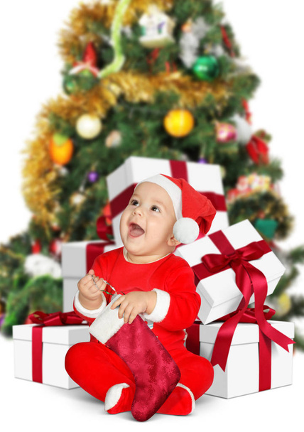 Funny baby Santa Claus with Christmas gifts on white - Foto, Bild