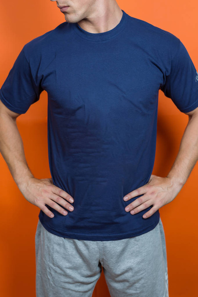 man wearing blue t-shirt, clothing design concept - 写真・画像