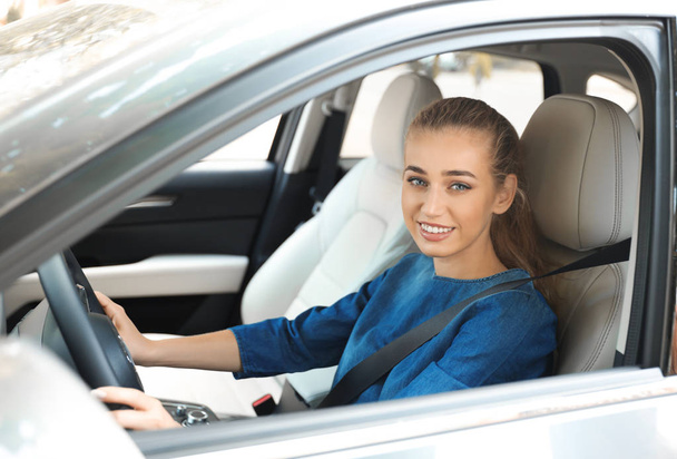 Female driver with fastened safety belt in car - Zdjęcie, obraz