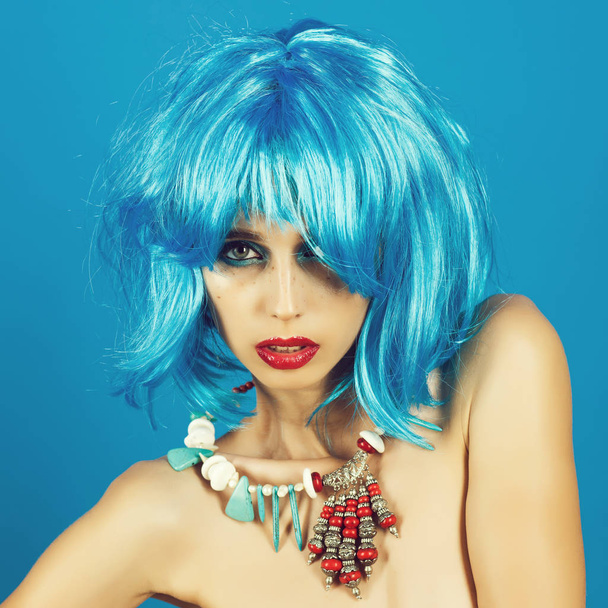 Woman in blue wig with fashionable makeup. - Фото, изображение