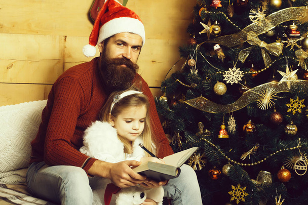 christmas bearded father and girl writting - Zdjęcie, obraz