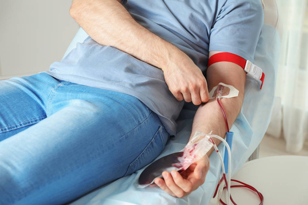 Man donating blood to save someone's life in hospital - Foto, Bild