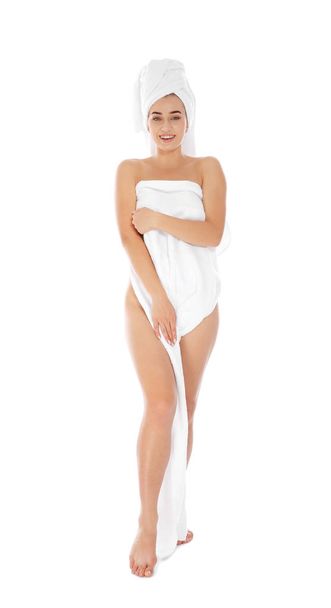 Full length portrait of young pretty woman with towels on white background - Фото, зображення