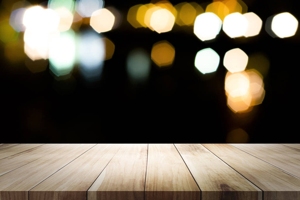 Empty wooden table platform and bokeh at night. - Photo, Image