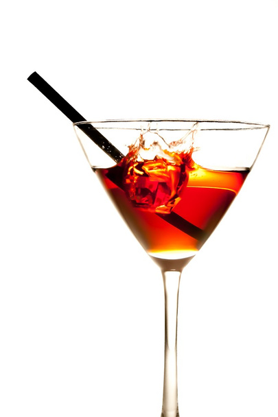 red cocktail with splash and straw - Foto, Imagen
