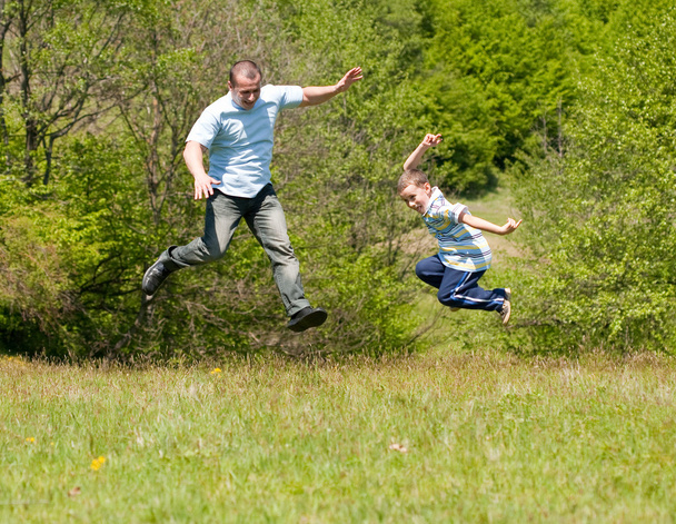 Father and son having good time together - Foto, afbeelding