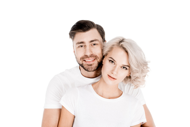 Atraente jovem casal adulto abraço isolado no branco
 - Foto, Imagem