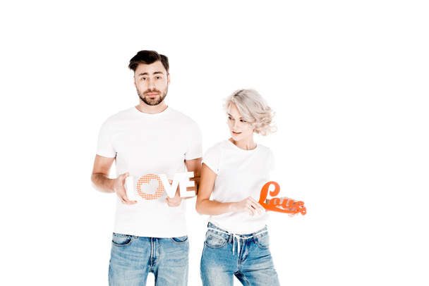 Great attractive couple holding signs love isolated on white  - Photo, Image