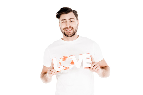 Bonito sorridente jovem adulto homem mostrando sinal de amor isolado no branco
 - Foto, Imagem