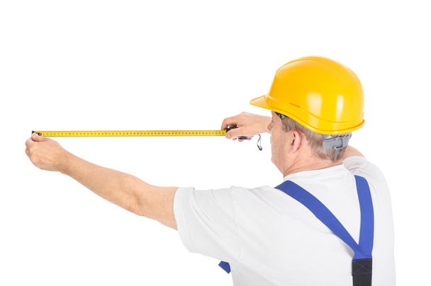 worker with measuring tape - Foto, Imagen