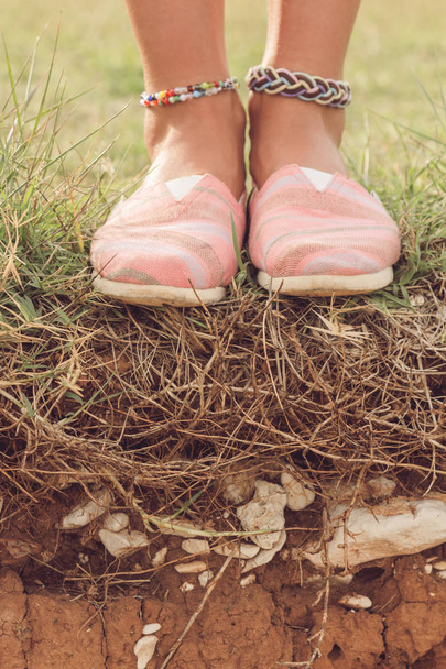 Detail of a young woman's shoes and anklet outdoors. - Photo, Image