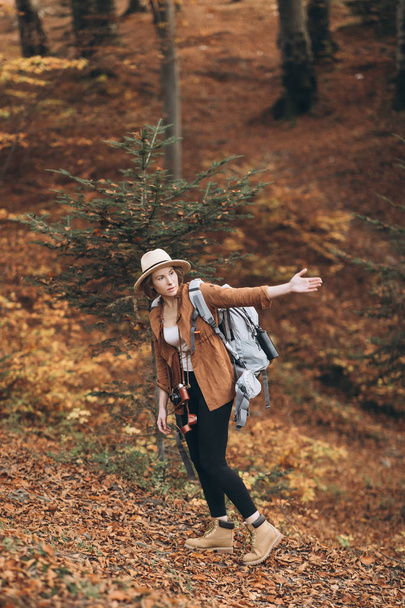 Caucasian woman looking at view copyspace in autumn woods - Foto, Bild