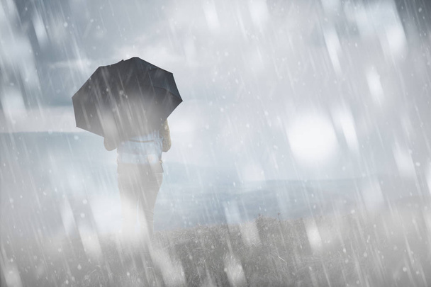 Girl with umbrella on a cold snowy / rainy day. - Фото, изображение