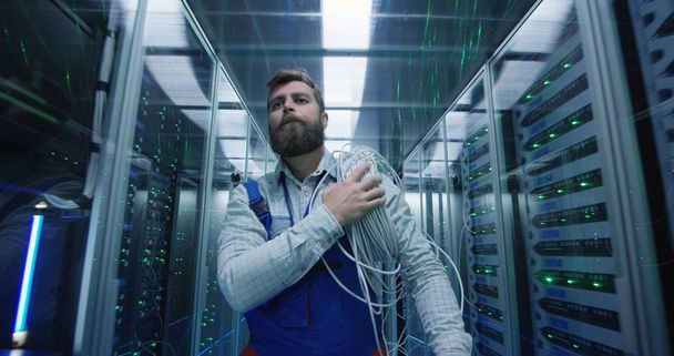 Male technician working in a data center - Photo, Image