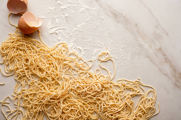 Dried egg noodles. Raw Fresh Spaghetti. - Photo, Image