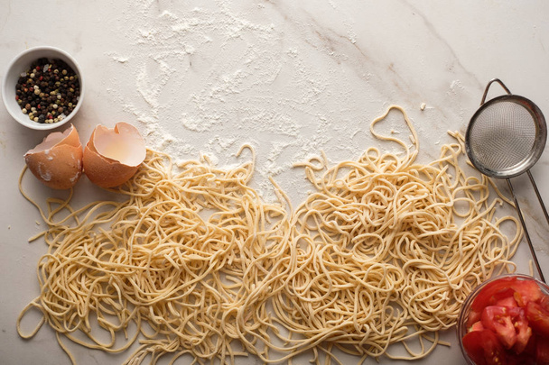 Dried egg noodles. Raw Fresh Spaghetti. - 写真・画像