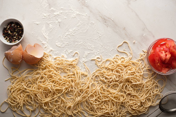 Dried egg noodles. Raw Fresh Spaghetti. - Φωτογραφία, εικόνα