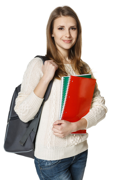 woman wearing a backpack and holding botebooks - Foto, Imagen