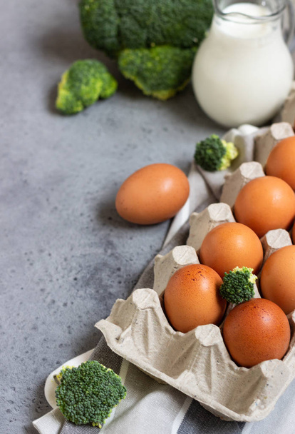 Eggs, milk and broccoli. Ingredients for making omelette or frittata. - Valokuva, kuva