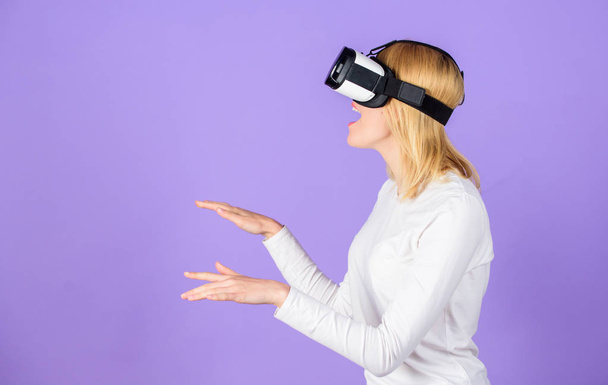 Explore virtual reality. Digital device and modern opportunities. Woman head mounted display violet background. Virtual reality and future technologies. Girl use modern technology vr headset - Foto, Imagen