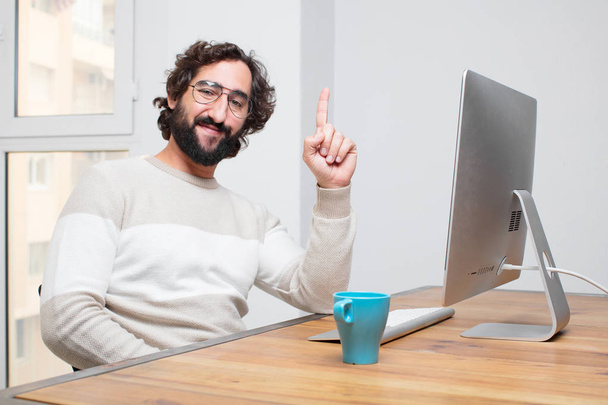 young bearded crazy freelancer working with his computer - 写真・画像