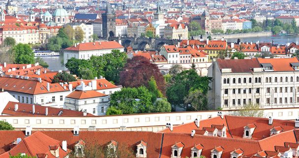 PRAGUE, CZECH REPUBLICMay 1, 2017: Roofs of the old city, View from the observation deck Prague Castle. - Фото, изображение
