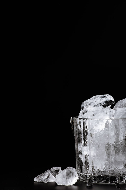 crystal bucket with ice on a dark background - Foto, imagen