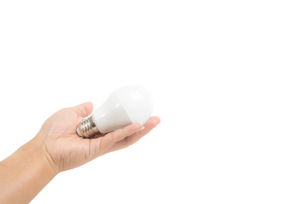 Электрическая лампа в руке молодого человека, держась изолированы на белом
  - Фото, изображение