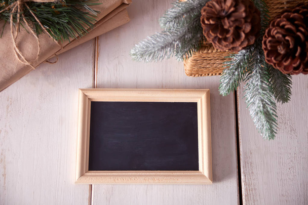 Christmas holiday decorations with blackboard on white background - Photo, Image
