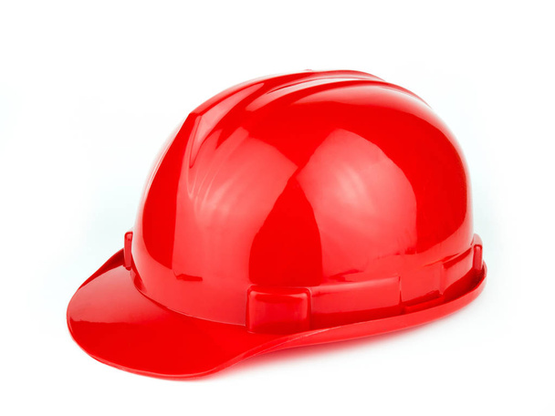 Red construction safety helmet isolated on white background. - Photo, Image