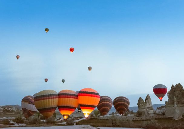 Morning start of Hot air balloon flying over Cappadocia. - Фото, изображение
