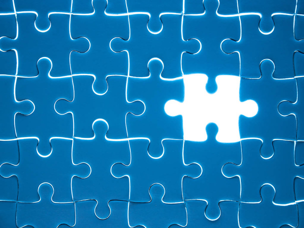 Missing Jigsaw puzzle piece with lighting, business concept for completing the finishing puzzle piece. - Photo, Image