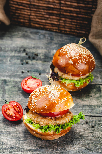 Chicken burgers on wooden background. Close up - Foto, immagini
