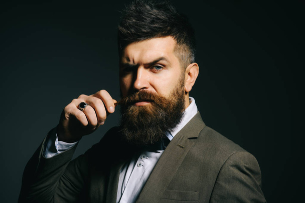 People in fashion treat it as a business. Bearded man after barber shop. Man with long beard in business wear. Business as usual. Mens fashion. Barber in shop - 写真・画像
