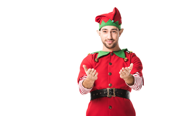 hombre en traje de elfo de Navidad con las manos extendidas gesto mirando a la cámara aislada en blanco
 - Foto, Imagen