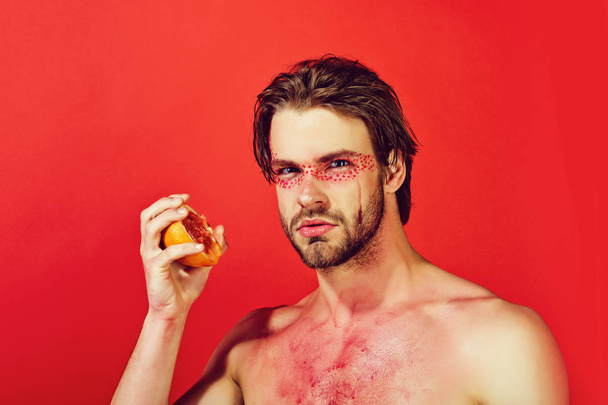 half of a juicy grapefruit in hand of man, vitamin - Фото, изображение