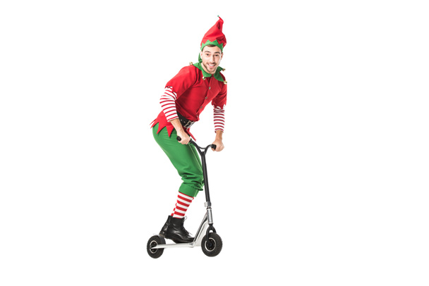 excité homme en costume d'elfe de Noël sauter dans l'air sur push-cycle isolé sur blanc
 - Photo, image