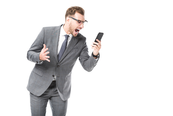 angry adult businessman shouting at smartphone isolated on white - Foto, Imagem