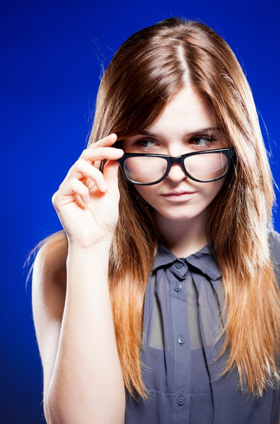 Strict young woman with nerd glasses - Valokuva, kuva
