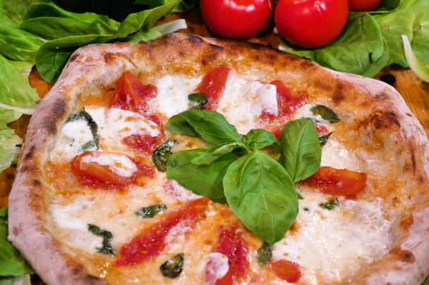 Composition of a typical Italian pizza with ingredients typical of Italian gastronomy. Concept of: pizza, Italian tradition, Naples, Mediterranean flavors - Foto, immagini